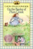 On the Banks of Plum Creek (Paperback, 1st HarperTrophy ed.) - Laura Ingalls Wilder Photo